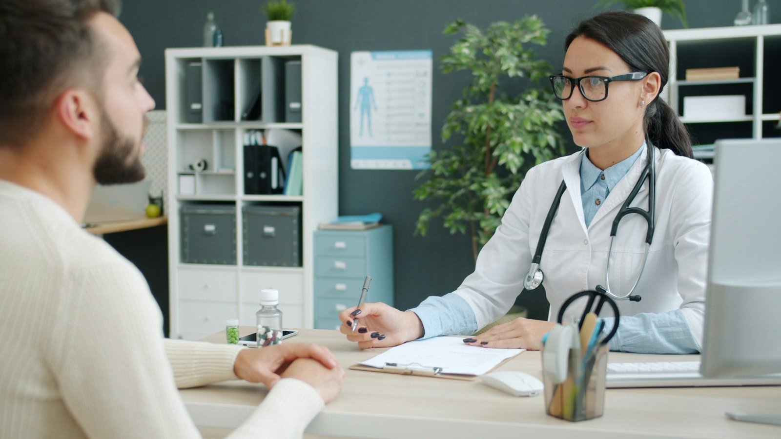 Dr. Lena Calloway talking with a patient across her desk
